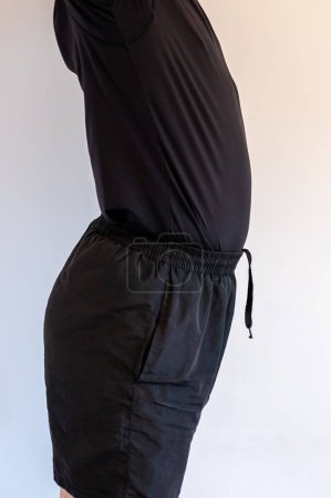 Foto de Lordosis curvature of the spine. Man with lordosis. A common body posture defect. - Imagen libre de derechos