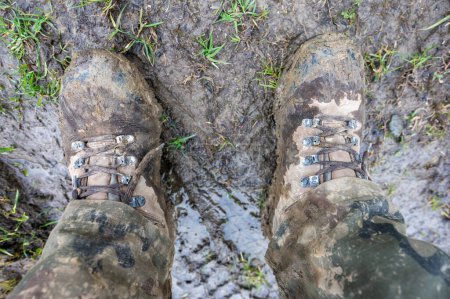Dirty soldier's tactical boots after the drills in mud.