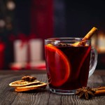 mulled wine on the background of the Christmas decoration. Selective focus.