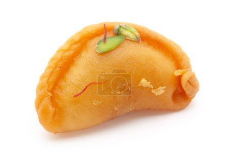 Photo for Close-up of Indian Traditional sweet "Gujiya", Garnished with kesar strands and chunks of pista. Front view, isolated on white. - Royalty Free Image