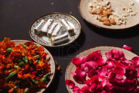 Indian Cashew-rich sweet "Kaju Roll" with dry fruits and flower petals.