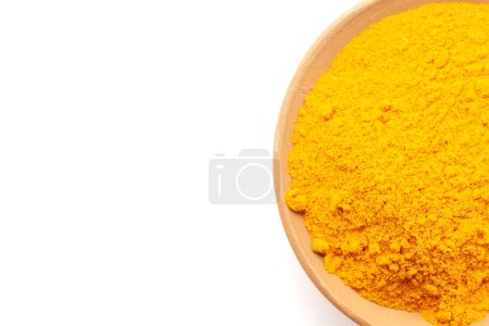 Top view of Earthen pot filled with Turmeric (Haldi) isolated on white.