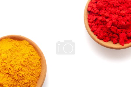 Top view of Earthen pot filled with Red sindoor and Turmeric (Haldi), isolated on white.