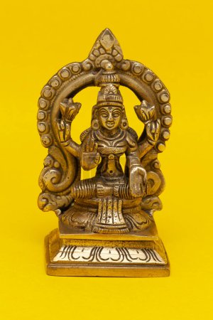 The idol statue of the Hindu God made of brass material represents the Indian goddess Lakshmi.