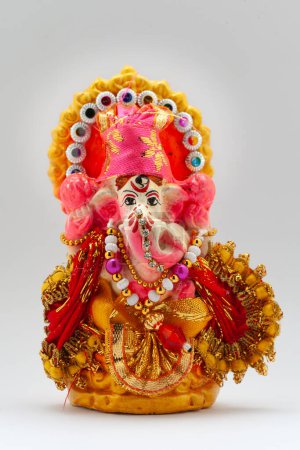 Colorful decorative Indian Hindu Lord "Ganesha" in Diwali. Isolated on a white background.