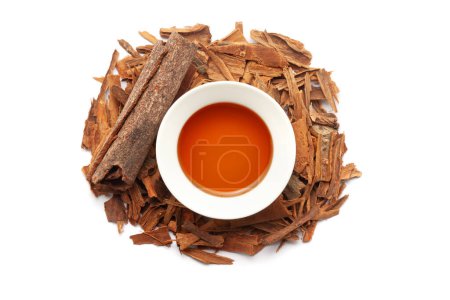 Top view of Dry organic Cinnamon sticks (Cinnamomum verum), along with its essential oil.