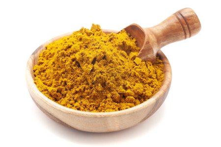 Front View of Organic digestive powder called "Buknu" a mixture of Indian ayurvedic herbs and spices, in a wooden bowl with a wooden scoop. Isolated on a white background.