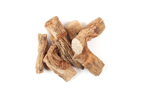 A pile of Dry Organic Sweet flag or Vach (Acorus calamus) roots, isolated on a white background. Top view