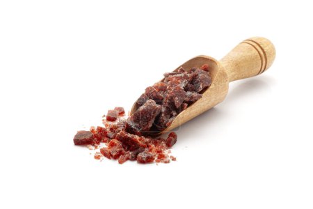 Front view of a wooden scoop filled with Organic coarse Indian Black Salt(sodium chloride). Isolated o n a white background.