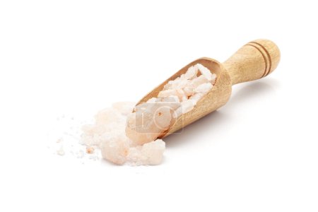 Front view of a wooden scoop filled with Organic Himalayan pink rock salt (sodium chloride). Isolated on a white background.