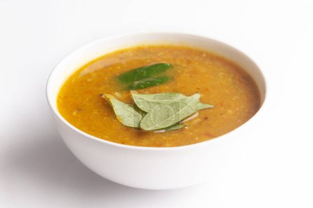 Close-up of Sambhar or Sambar is a popular south Indian food, made with lentils and many vegetables  and garnished with curry leaves.