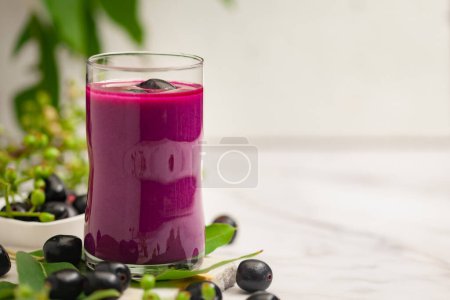 Close-Up of Shake or pulp or juice of Indian Ayurvedic medicinal fresh organic fruit jamun (Syzygium Cumini) with its seeds plum ( jamun seeds are kind of Ayurvedic herb for diabetes)