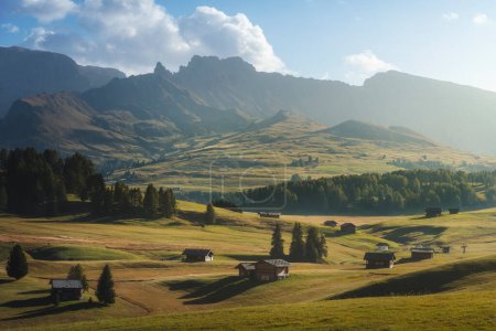 Photo for Alpe di Siusi or Seiser Alm, wooden huts view. Dolomites Alps, Trentino Alto Adige South Tyrol, Italy, Europe - Royalty Free Image