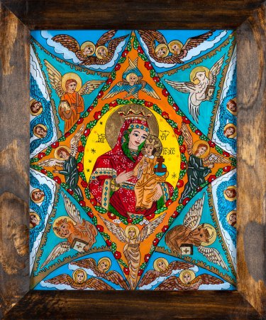 Photo for Icon painted on reverse glass in the naive orthodox style of Eastern Europe depicting Virgin Mary and baby Jesus. Framed icon. - Royalty Free Image