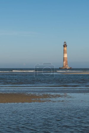 Photo for Morris Island Lighthouse from the shoreline of Folly Beach near Charleston, South Carolina. - Royalty Free Image