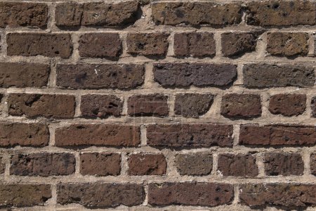 Texture de fond d'un très vieux mur de briques.