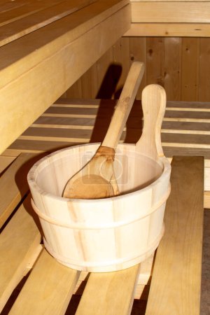 Photo for Close-up of wooden sauna bucket with wooden ladle. - Royalty Free Image