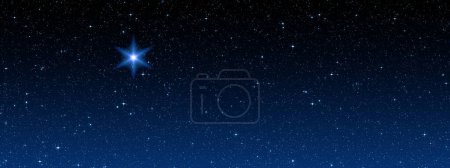 Foto de Brillante estrella de Navidad en el cielo estrellado - Imagen libre de derechos
