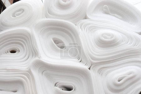 Photo for White colored rolled foam stock on shop for sell - Royalty Free Image
