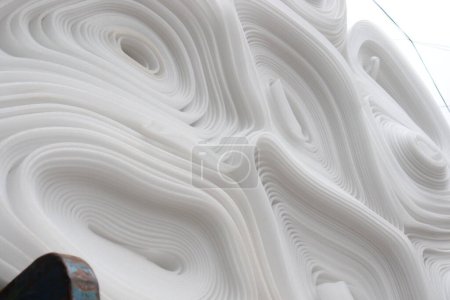 Photo for White colored rolled foam stock on shop for sell - Royalty Free Image