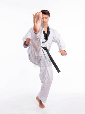Photo for Taekwondo high kick - black belt  taekwondo athlete martial arts master , handsome man show high kick pose during fighter training isolated on white background - Royalty Free Image