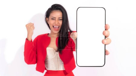 Photo for Beautiful Asian brunette woman cute girl in red dress  ,Excited surprised girl showing big smart phone with blank screen , white screen isolated on white background , Display Mock Up Image - Royalty Free Image
