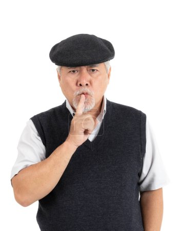 Photo for Asian senior man , old man feel serious Bad mood angry keeps his finger in his mouth , making silence gesture isolated on white background - lifestyle senior male concept - Royalty Free Image