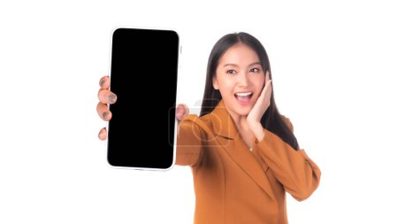 Photo for Beautiful Asian young woman ,Excited surprised girl showing smart phone with blank screen , black screen for Mobile App Advertising isolated on white background , display Mock Up Image - Royalty Free Image