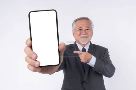 Téléchargez les photos : Asian senior businessman , old man with suit feel happy good health showing big smart phone with blank screen , white screen isolated on white background , Mock Up Image - en image libre de droit
