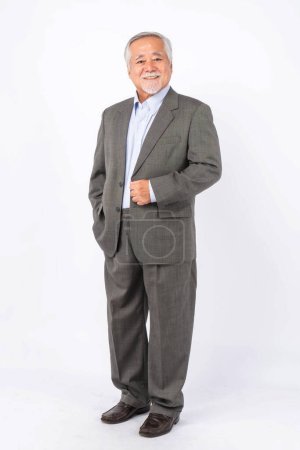 Photo for Full length portrait of a business man senior management , Asian senior man , old man with suit isolated on white background with copy space - lifestyle senior male concept - Royalty Free Image