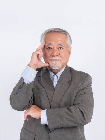 Photo for Portrait of a senior business man with suit , Asian senior man , old man , serious face thinking about something isolated on white background - lifestyle senior male thinking about question - Royalty Free Image