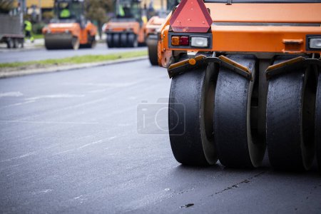 Photo for Road construction and asphalting machinery in action. - Royalty Free Image