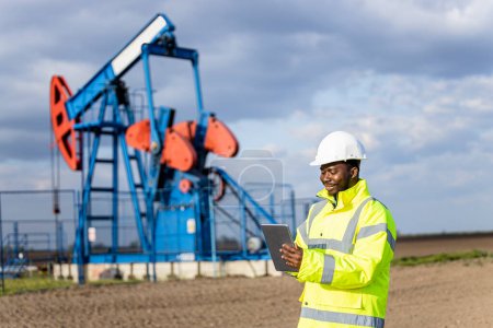 Photo for Oil and gas industry. Worker controlling crude oil production. - Royalty Free Image