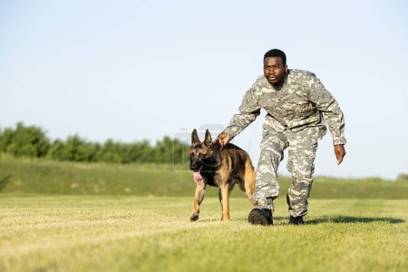 Photo for Soldier and military dog at training camp doing exercises. - Royalty Free Image