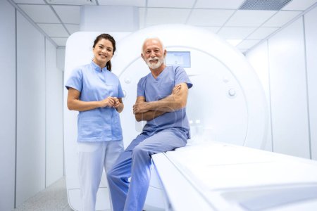 Photo for Portrait of smiling female doctor and senior patient ready for MRI examination test in hospital. - Royalty Free Image