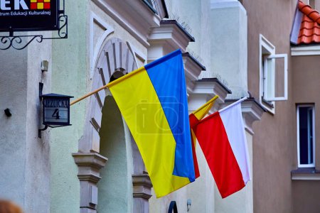 Photo for Warsaw, Poland, August 9, 2022: Ukrainian flag on the street of Poland's capital, Warsaw - Royalty Free Image