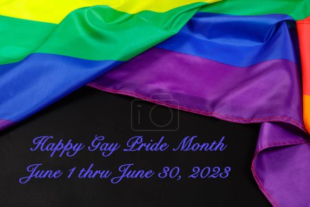 Téléchargez les photos : The Gay Pride Flag used for Illustrations with black background saying Happy Gay Pride Month - en image libre de droit