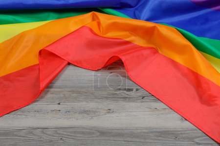 Foto de The Gay Pride Flag used for Illustrations with wooden background and copy space - Imagen libre de derechos