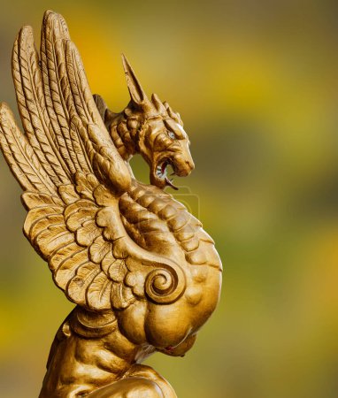 Photo for Close up of a Mythical Dragon standing guard outside the entrance to a building - Royalty Free Image