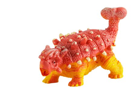 Foto de Un dinosaurio de juguete de plástico aislado sobre un fondo blanco con espacio para copiar - Imagen libre de derechos