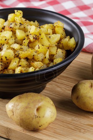 Photo for Close up of a bowl of fried Potatoes with copy space - Royalty Free Image