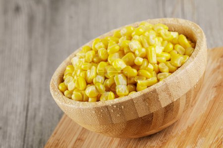 Photo for Close up of a wooden bowl of delicious Sweet Corn with copy space - Royalty Free Image