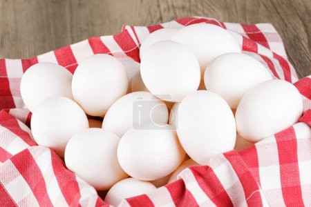 Photo for Close up of  a basket of fresh raw White Eggs with  copy space - Royalty Free Image
