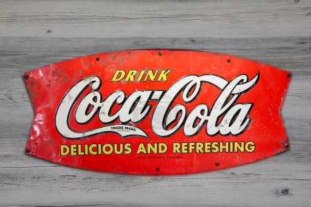 Photo for Vintage Metal Coca Cola Sign isolated on wooden background with copy space - Royalty Free Image