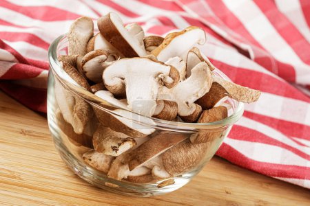 Photo for Delicious Sliced Shiitake Mushrooms isolated on a wooden background with copy space - Royalty Free Image