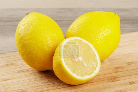 Photo for Healthy Lemons isolated on a wooden background with copy space - Royalty Free Image
