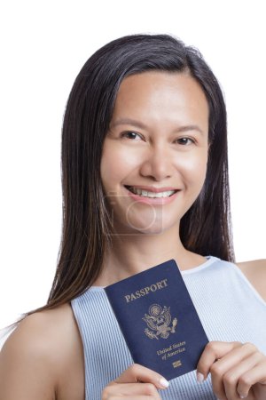 Photo for Asian American Woman holding her American Passport isolated on a white background with copy space - Royalty Free Image