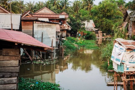 Photo for Poor Cambodians living in poverty along a river in South East Asia - Royalty Free Image