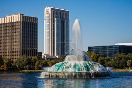 Photo for Orlando Florida skyline across Lake Eola with its fountain in the foreground, Orlando, USA, North America and copy space - Royalty Free Image
