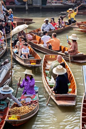 Photo for Selling food and souvenirs at the Damnoen Saduak floating market located about 62 miles outside of Bangkok Thailand, Southeast Asia - Royalty Free Image